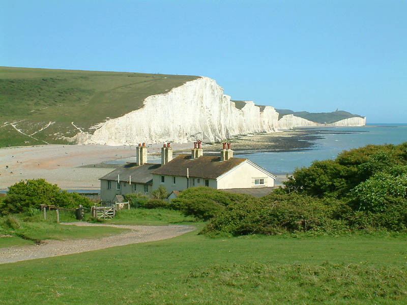 Seven_Sisters_cliffs_and_the_coastguard_cottages,_from_Seaford_Head_showing_Cuckmere_Haven_(looking_east_-_2003-05-26)